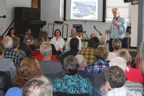 Sam Fevez, aka Solar Sam, addresses the crowd at Clar-Mill Hall Sunday. Photo/Craig Bakay